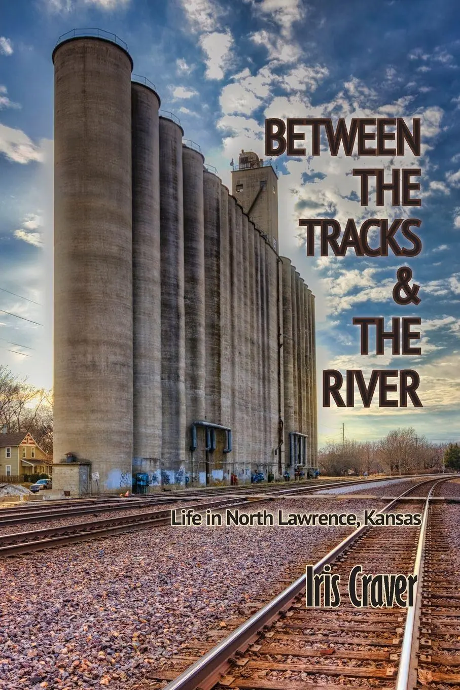 Cover: 9781960462619 | Between The Tracks And The River | Life in North Lawrence, Kansas