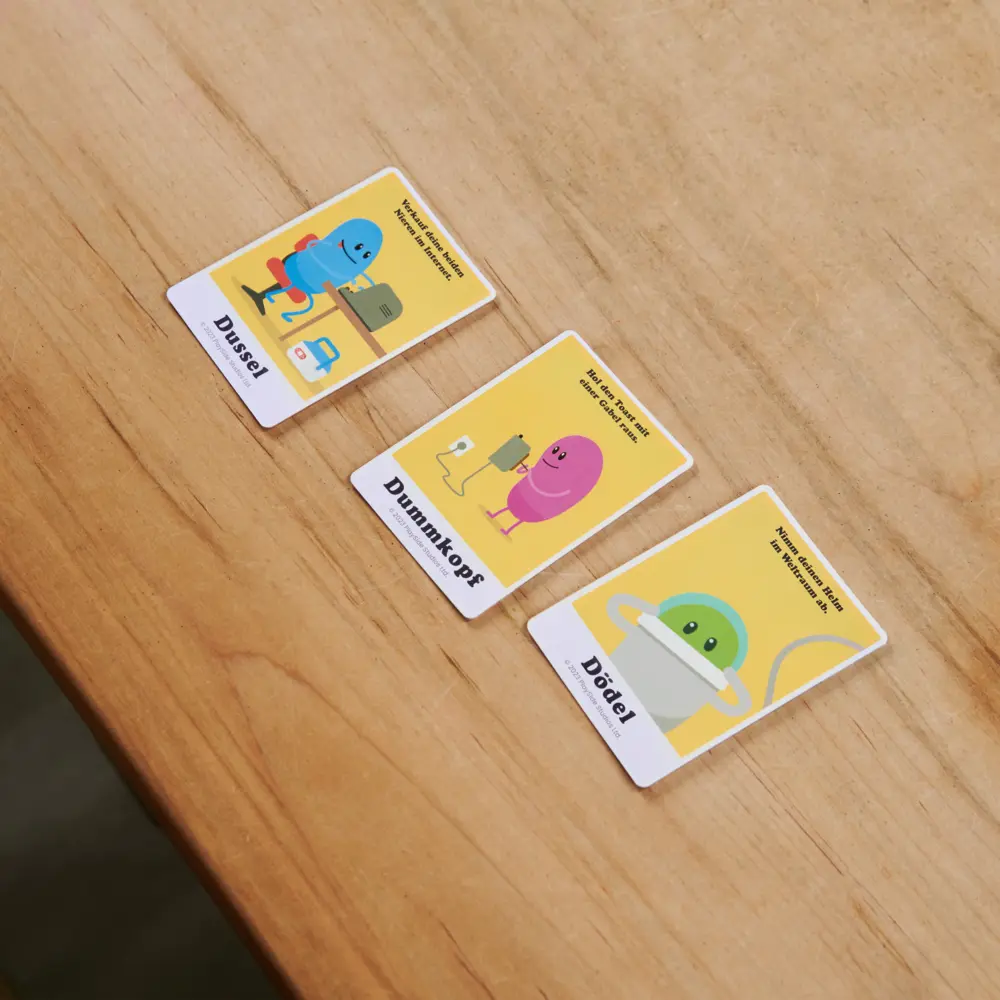 Bild: 681147044258 | BGM Dumb Ways to Die | Spiel | Karton | 44258 | Deutsch | 2025